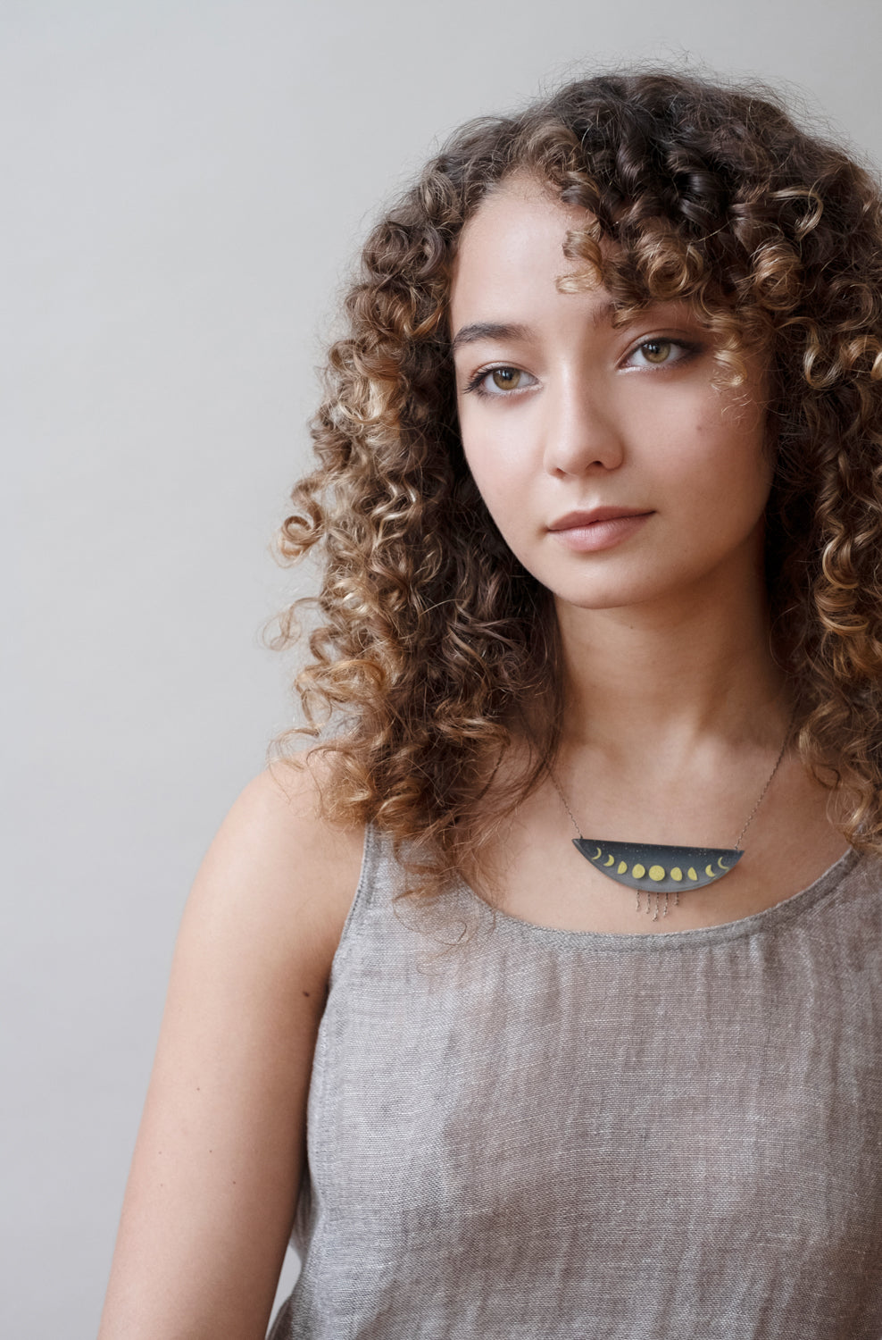 Model wearing Golden Phases Necklace