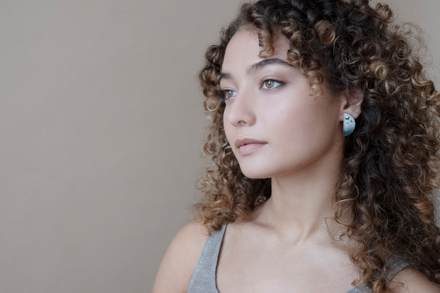 Model wearing Flock Half Circle Earrings