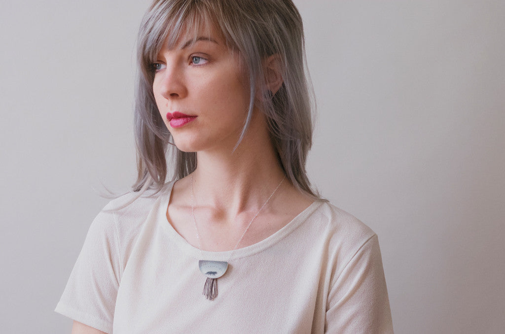 Model wearing foxy necklace