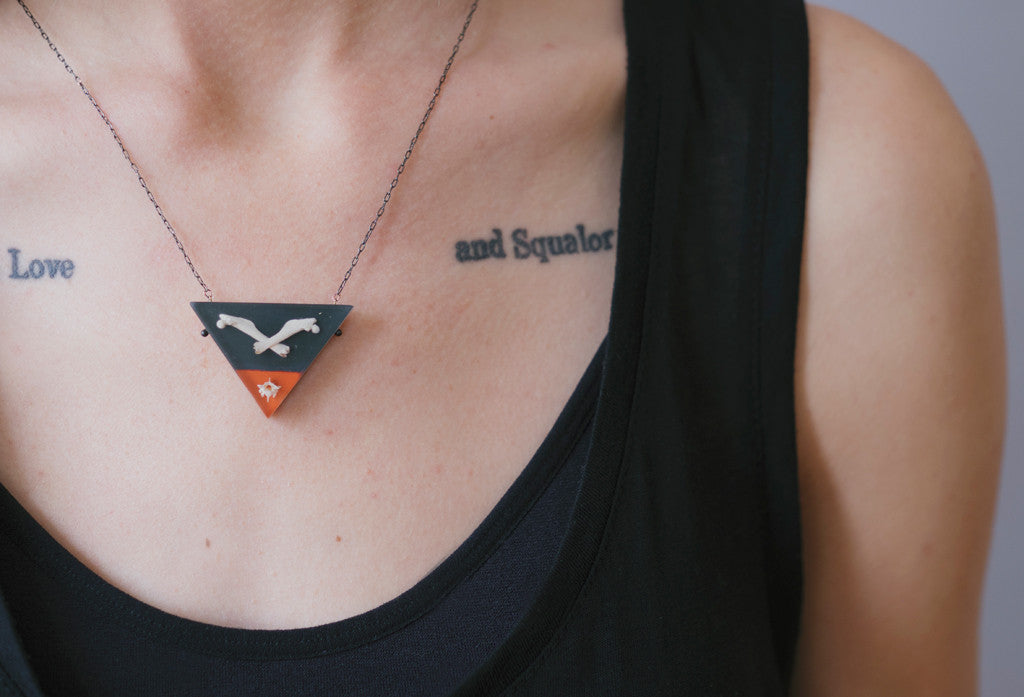 Model wearing bones necklace